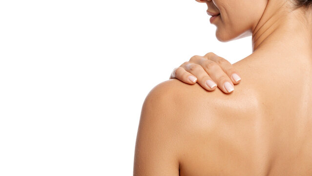 Beautiful naked woman's back, healthy skin and slim torso, hands massaging her shoulder and neck, symbolizing health, beauty, and pain relief through spa and healthcare