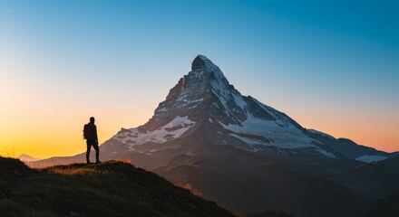 Fototapeta premium Photo Man Silhouette At Mountain Peak Summit During Warm Sunset Light