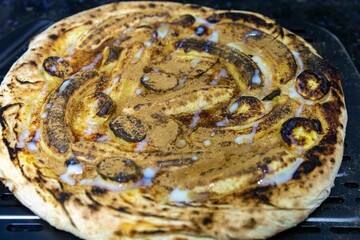 Traditional Brazilian sweet banana pizza with cinnamon and condensed milk. The best pizza in the world