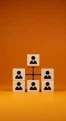 Wooden Blocks Arranged in a Hierarchy on Orange Background Structure Team
