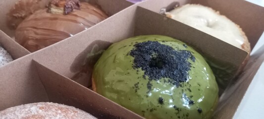 Donuts without a hole in the middle with various toppings