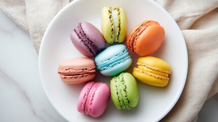 Fototapeta premium Colorful Assorted Macarons on White Plate with Soft Fabric Background for Dessert and Confectionery Photography