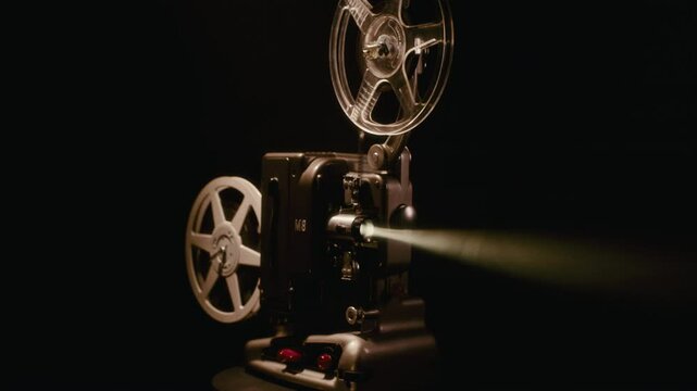 Vintage Bolex M8 Film Projector Operating In Darkness With 8mm Reel