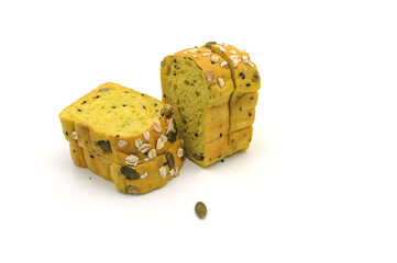 Sliced Pumpkin Bread with Mixed Grains on White Background