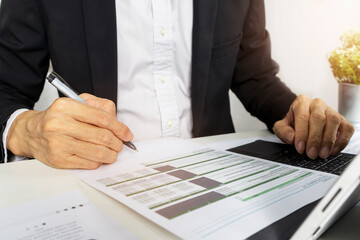 Executives sit and sign documents and agreements on financial and trade investment business.