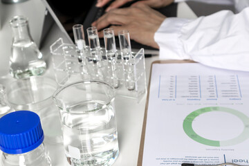 Researchers study data and conduct chemical experiments, in the creation of drugs, scientific data collection experiments