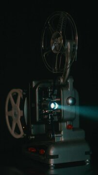 Vintage Bolex M8 Projector Operating In A Dark Room