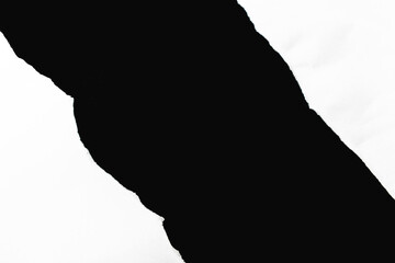White paper crumples and torn edges of paper with a black background for graphic design and text insertion.