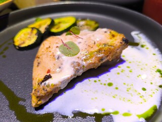 chicken breast baked with eggplant pieces in a frying pan