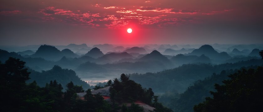 Majestic sunrise over misty mountain ranges in china