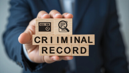 Businessman holding colorful blocks sees inscription CRIMINAL RECORD. Concept of criminal records