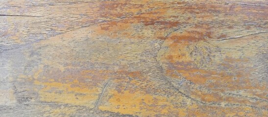Distressed Wooden Surface with Faded Yellow Paint Texture
