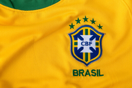 BANGKOK, THAILAND - 20 May 2025: Logo of Brazil national team on football jersey yellow background with green stripes.