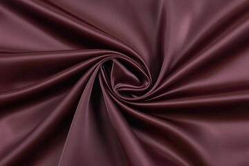 Obraz premium Deep maroon satin fabric with smooth texture.
