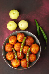 Homemade Amla and Green Chilli Pickle Preparation in Indian Kitchen
Amla Pickle or gooseberry pickle It is a spicy condiment made with Amla also known as Indian gooseberries,