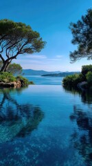 Obraz premium Serene ocean view blends with an infinity pool surrounded by lush vegetation offering a tranquil vacation getaway