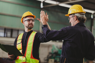 Two engineering man : Manufacture technical and factory staff working while Using digital tablet...