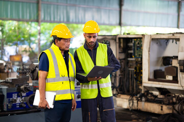 Two engineering man : Manufacture technical and factory staff working while Using digital tablet computer at industry factory