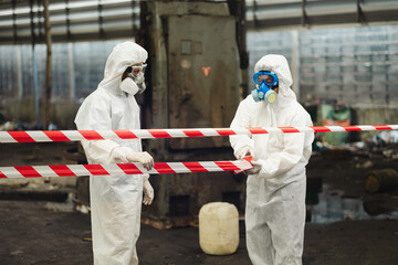 red barrier cross tape : No trespassing. Officials from the Department of Hazardous substances...
