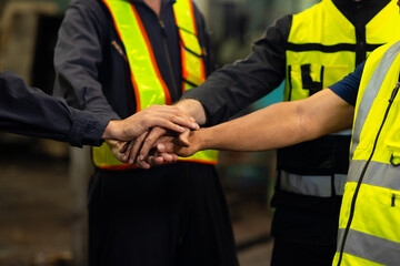 team hands together. Professional team working at workplace. Unity and teamwork. Group portrait engineer factory manager worker and mechanic team together in factory workplace