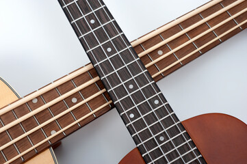 Four-string bass ukulele with wooden body and built-in tuner and pickup.