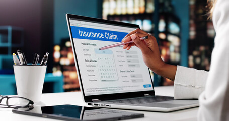 African American Woman Completing An Online Insurance Application
