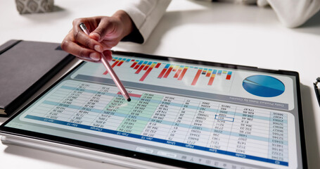 Analyzing Financial Data On Laptop Screen