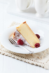 Piece of cheese cake on bright background.	