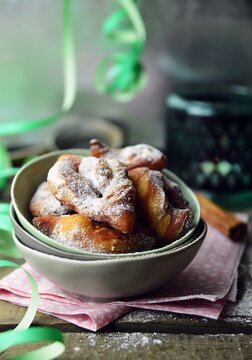 Close-up of a Bowl of traditional French Bugnes Lyonnaises (french doughnut) on a party table at mardi gras