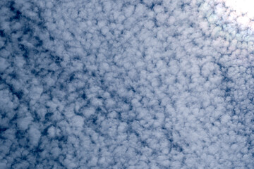Vast sky covered with fluffy clouds during bright midday hours