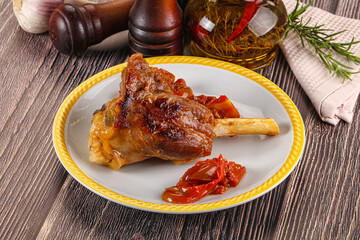Baked lamb shank with vegetables