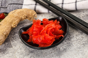 Marinated ginger root in the bowl