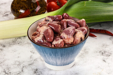 Raw chicken hearts in the bowl