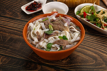 Vietnamese Pho Bo soup with beef and noodles