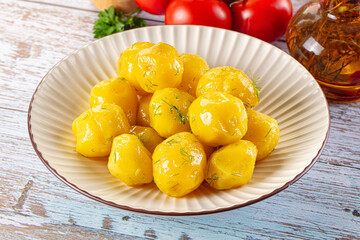 Boiled young potato with oil