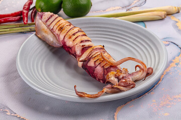 Tasty grilled wild squid with lime
