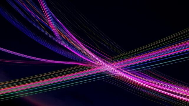Abstract lines wallpapers featuring colorful light streaks in the dark. Long exposure captures light streaks on a black background.
