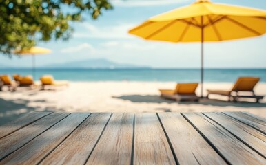 Fototapeta premium Beachfront wooden table with blurred background of yellow umbrellas, lounge chairs, and ocean