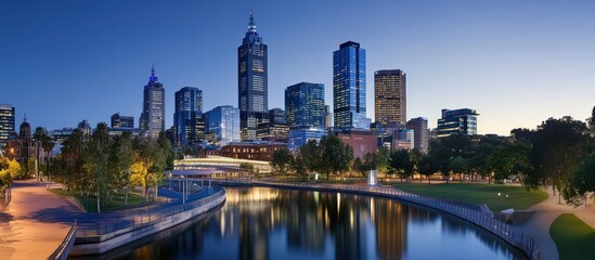 Obraz premium Picturesque cityscape reflection illuminating twilight urban skyline scenery