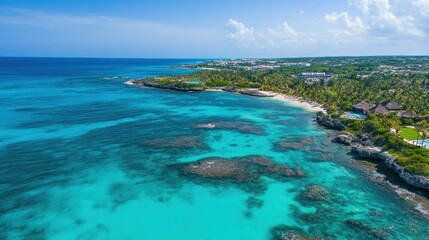 Fototapeta premium Aerial view of a stunning tropical coastline with vibrant turquoise water