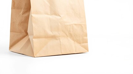 A close up shot of a brown paper bag sitting on a white surface in a brightly lit studio setting