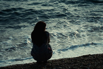 A lonely girl by the seaside
