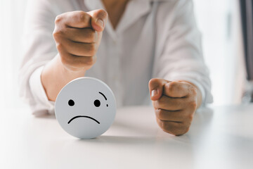 Close up customer hand choose sad face and blurred smiley face icon, Service rating, satisfaction...
