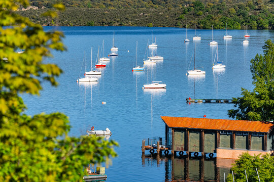 Small sailing boats in the Atazar reservoir, the largest in the Community of Madrid, Spain.