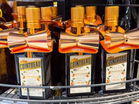 Cointreau bottles on store shelf with bow tie packaging