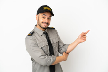 Young security  caucasian man isolated on white background pointing finger to the side