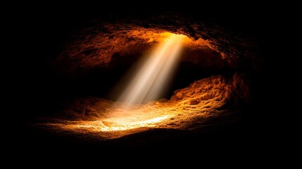 A radiant beam pierces the inky blackness of a cavern, illuminating a golden floor and textured walls