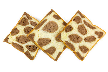 Three slices of uniquely patterned bread, resembling giraffe or leopard spots with light and dark brown variations, are arranged neatly on a clean white background.
