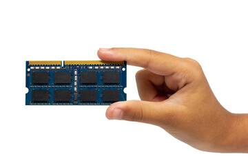 A close-up, eye-level shot of a child's hand holding a laptop RAM (Random Access Memory) module against a clean white background.