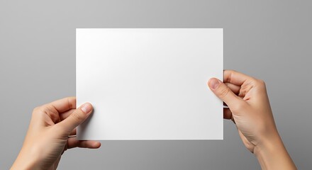 Obraz premium Hands Holding a Blank Canvas